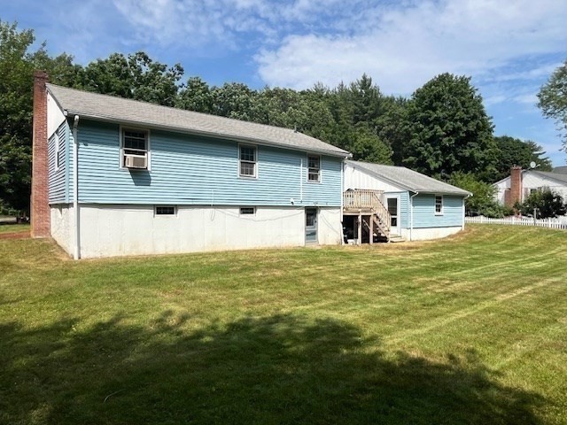 404 Cedar Street Hanover, MA 02339 - Photo 4 of 17 a front view of house with yard and trees in the background