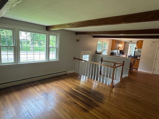 404 Cedar Street Hanover, MA 02339 - Photo 6 of 17 a view of an empty room with wooden floor and a window