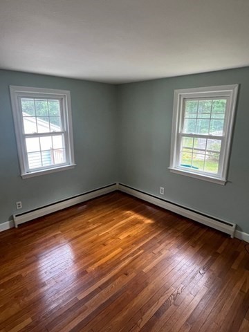 404 Cedar Street Hanover, MA 02339 - Photo 9 of 17 a view of a room with wooden floor and windows
