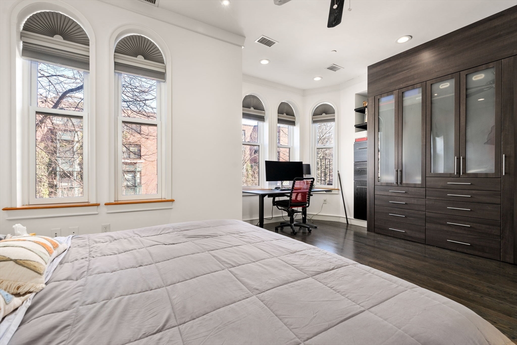 112 West Concord Street, Unit 2 Boston, MA 02118 - Photo 5 of 11 a bedroom with a large bed and a large window