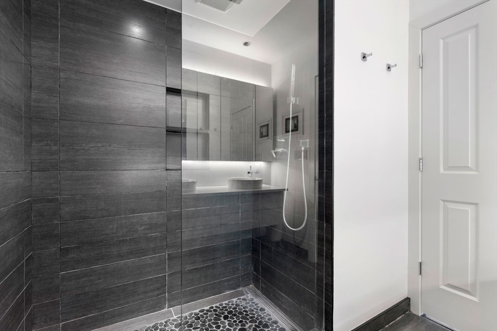 112 West Concord Street, Unit 2 Boston, MA 02118 - Photo 8 of 11 a bathroom with a glass shower door
