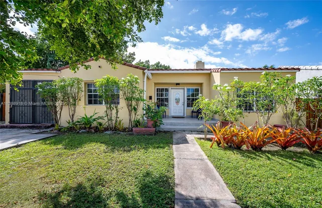 front view of a house with a yard