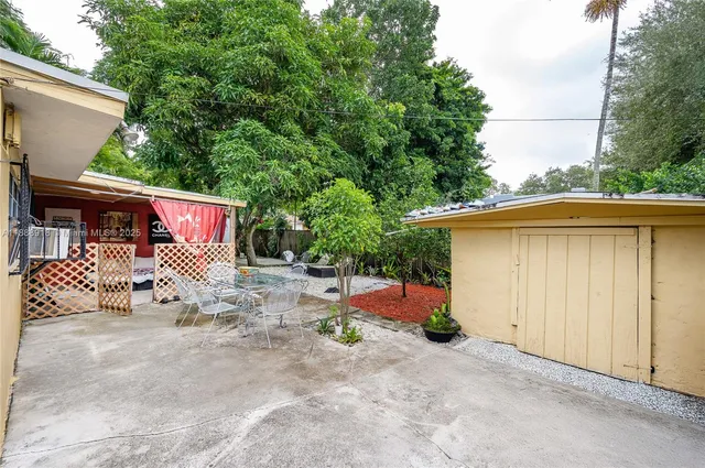 a view of a house with a yard and garage
