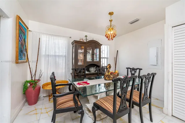 a kitchen with stainless steel appliances granite countertop wooden cabinets a stove top oven a sink and dishwasher