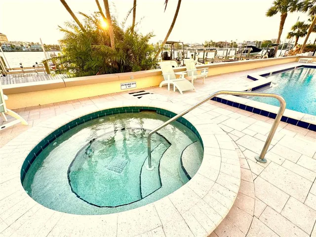 a view of swimming pool from a lake view