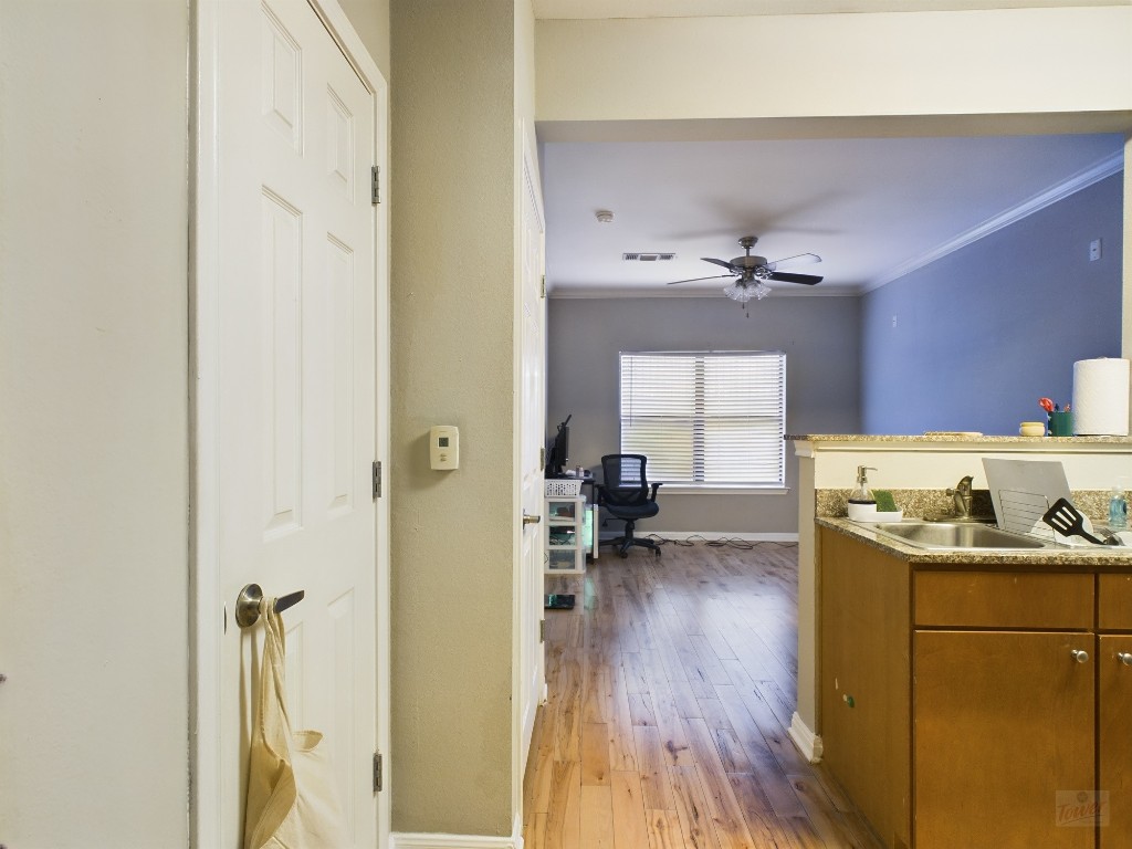 a kitchen with a sink and cabinets