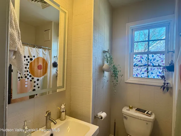 a bathroom with a toilet and a sink