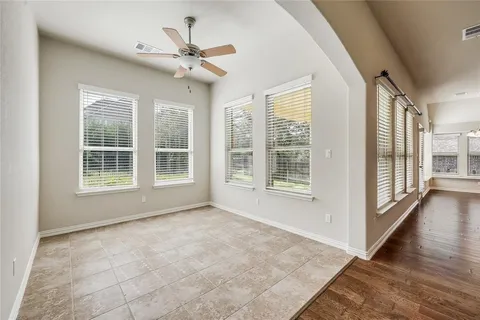 a view of an empty room with a window