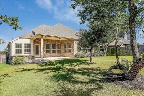 a house with trees in front of it