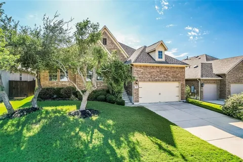 a view of a house with a yard and a slide