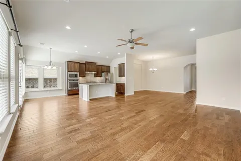 a view of kitchen with stainless steel appliances refrigerator oven and stove