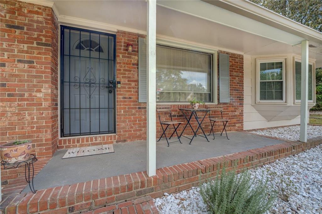 11889 Brown Bridge Road Covington, GA 30016 - Photo 2 of 27 a patio with table and chairs