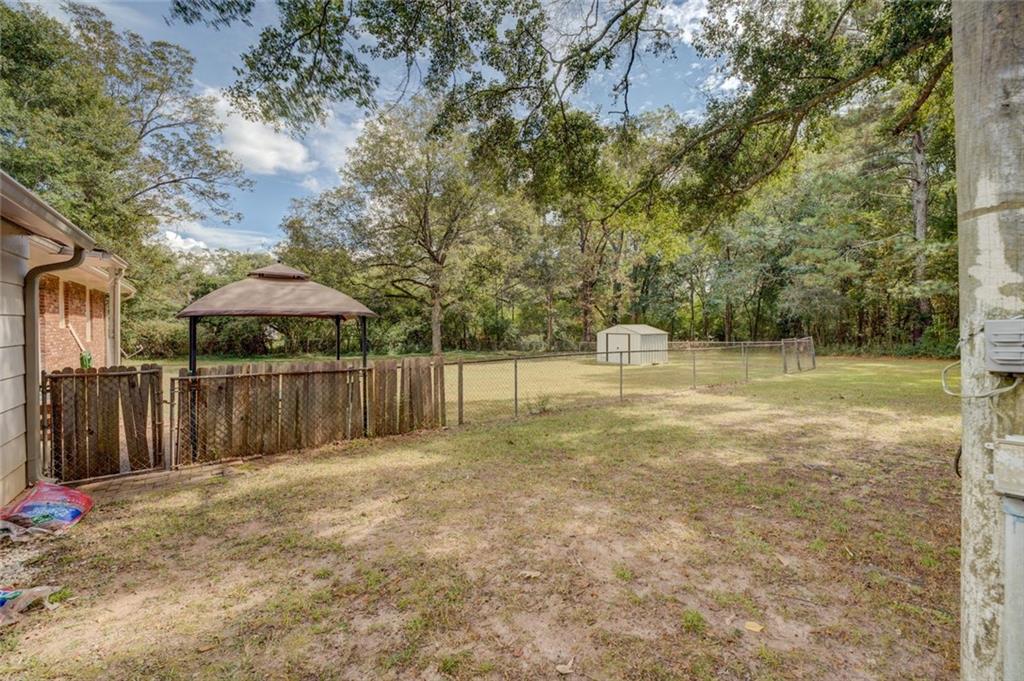 11889 Brown Bridge Road Covington, GA 30016 - Photo 25 of 27 a backyard of a house with lots of green space