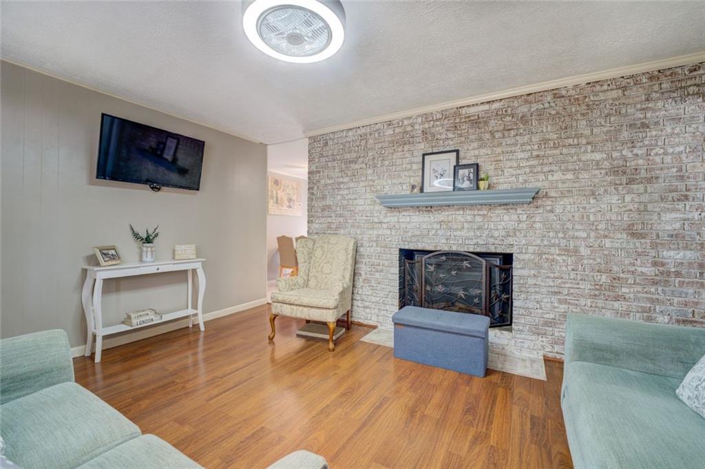 11889 Brown Bridge Road Covington, GA 30016 - Photo 6 of 27 a living room with furniture and a fireplace
