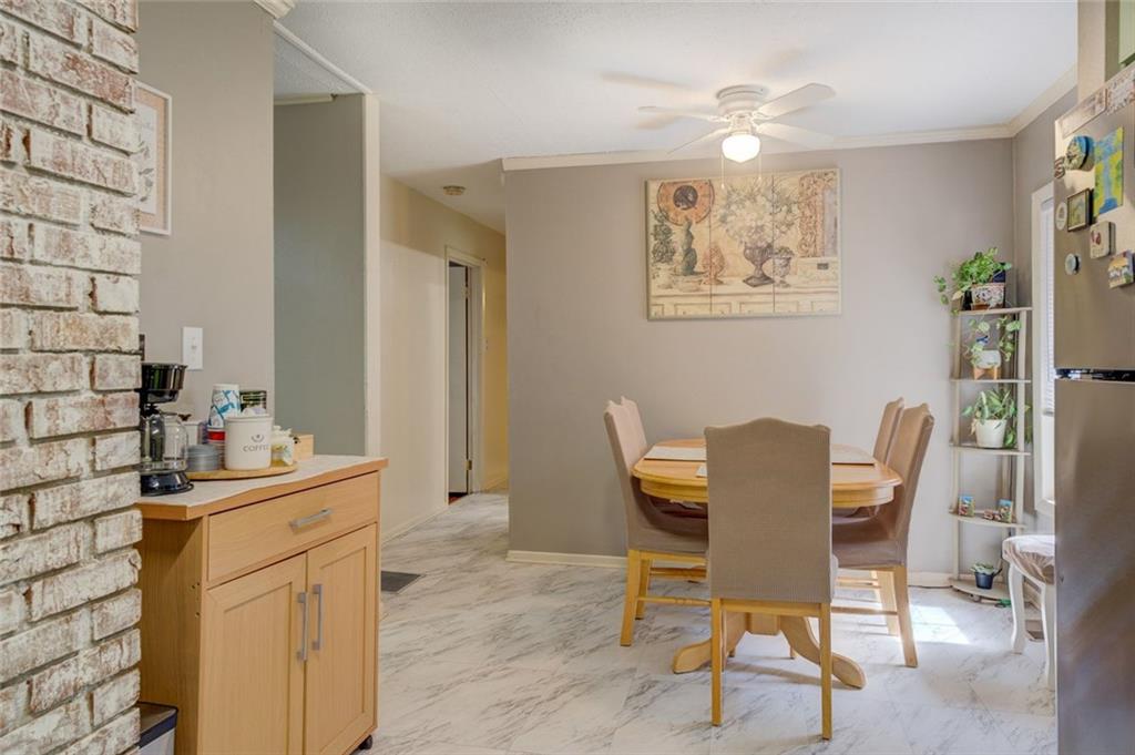 11889 Brown Bridge Road Covington, GA 30016 - Photo 7 of 27 a view of a dining room with furniture