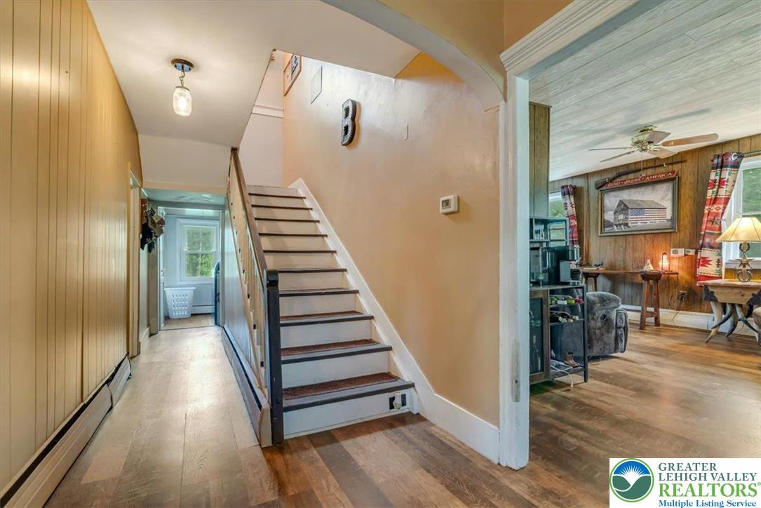 173 Anchorage Road Saylorsburg, PA 18353 - Photo 12 of 75 a view of a hallway with wooden floor and stairs