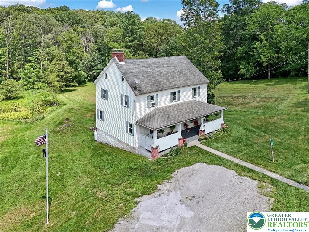 173 Anchorage Road Saylorsburg, PA 18353 - Photo 2 of 75 a aerial view of a house next to a big yard and large trees