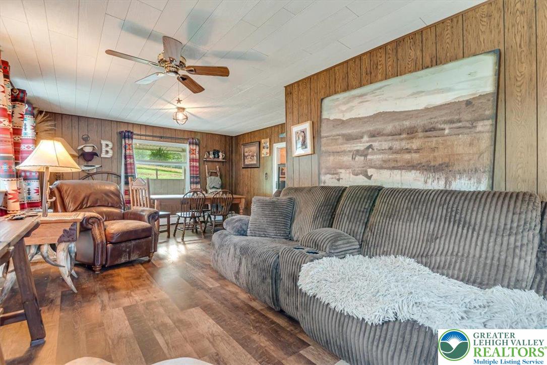 173 Anchorage Road Saylorsburg, PA 18353 - Photo 23 of 75 a living room with furniture and a large window