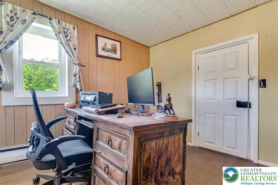 173 Anchorage Road Saylorsburg, PA 18353 - Photo 26 of 75 a view of a workspace with furniture and a window