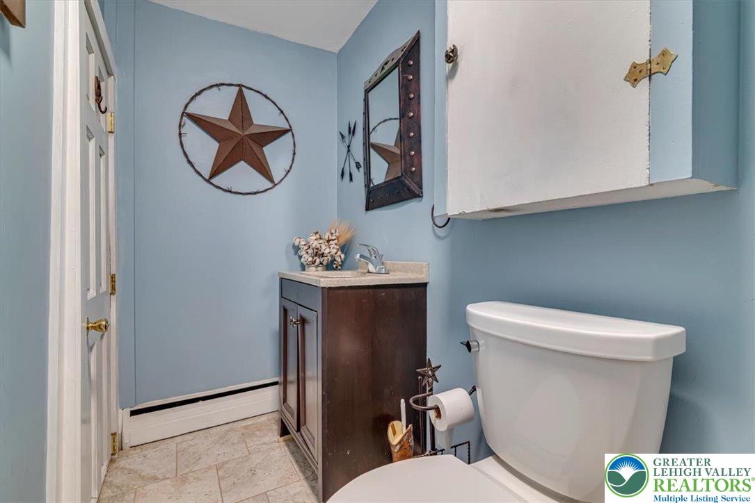 173 Anchorage Road Saylorsburg, PA 18353 - Photo 29 of 75 a white toilet sitting next to a bathroom sink