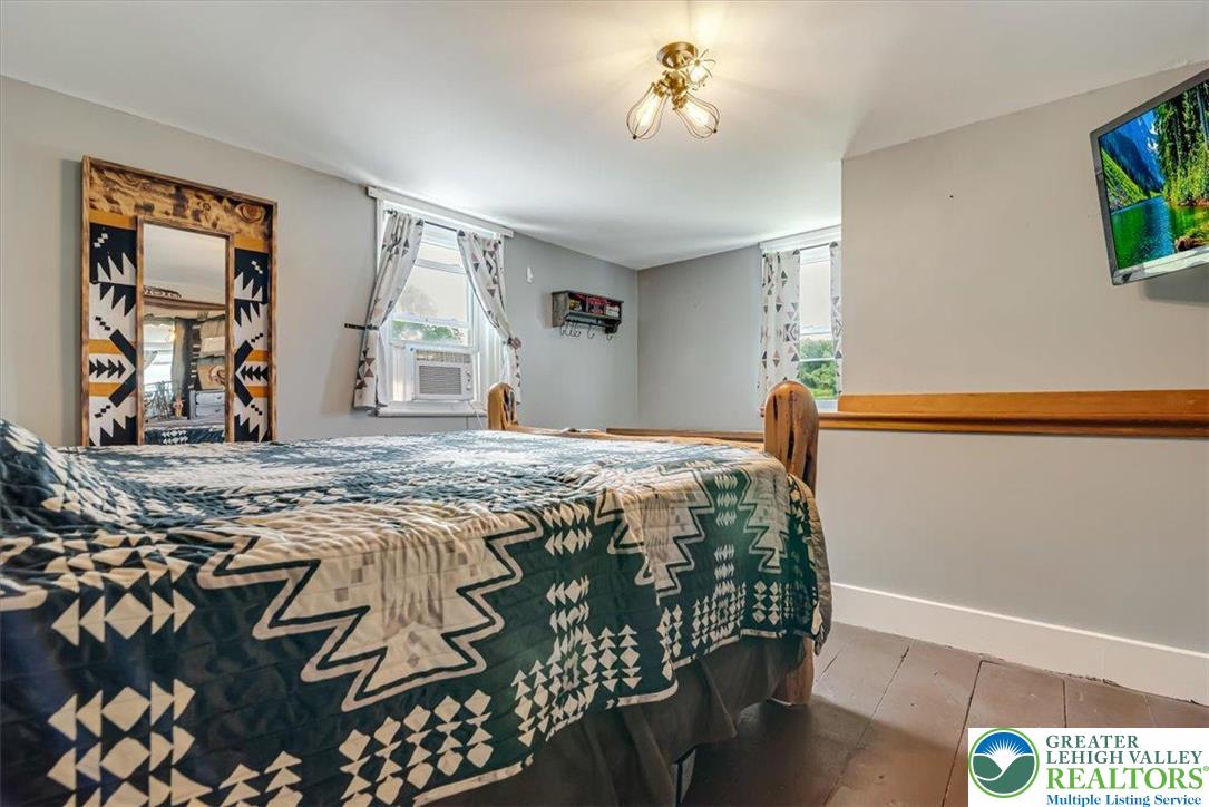173 Anchorage Road Saylorsburg, PA 18353 - Photo 40 of 75 a bedroom with a bed and a window