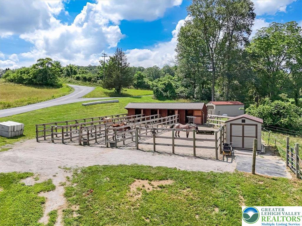 173 Anchorage Road Saylorsburg, PA 18353 - Photo 4 of 75 a view of a garden with a bench in a garden