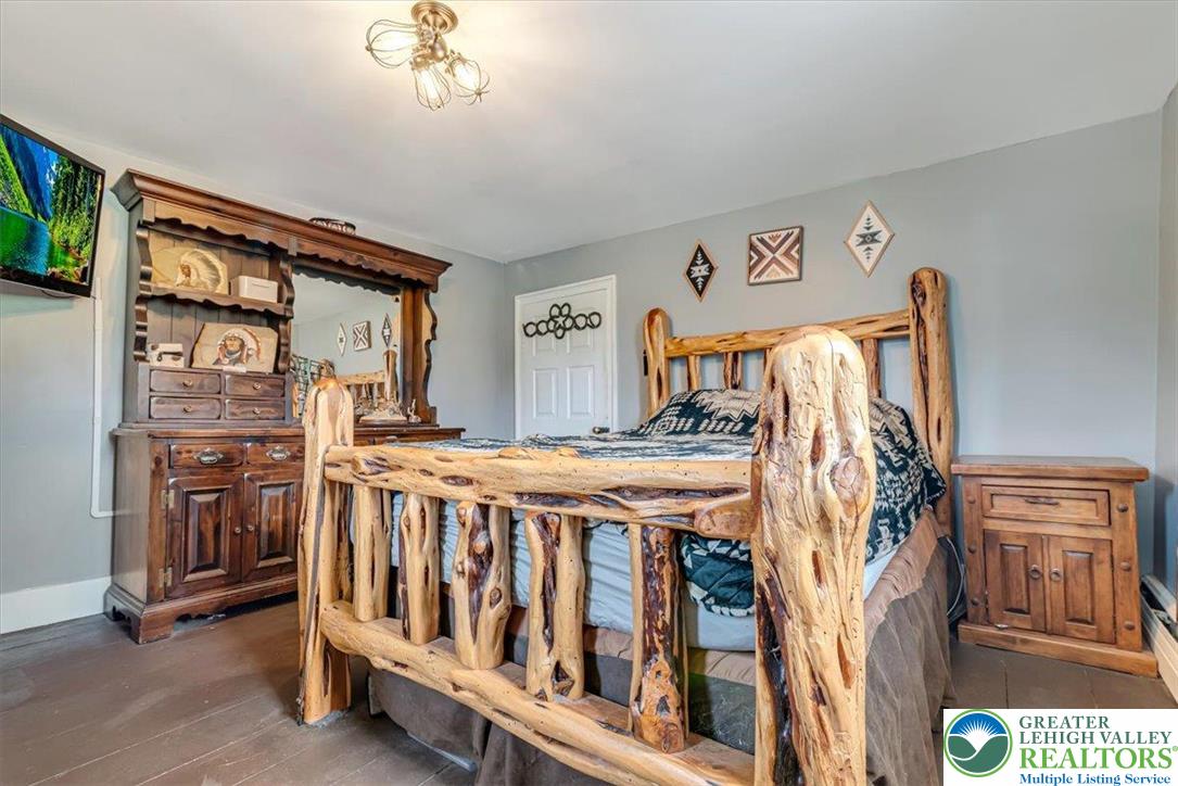 173 Anchorage Road Saylorsburg, PA 18353 - Photo 42 of 75 a view of a bedroom with furniture and windows