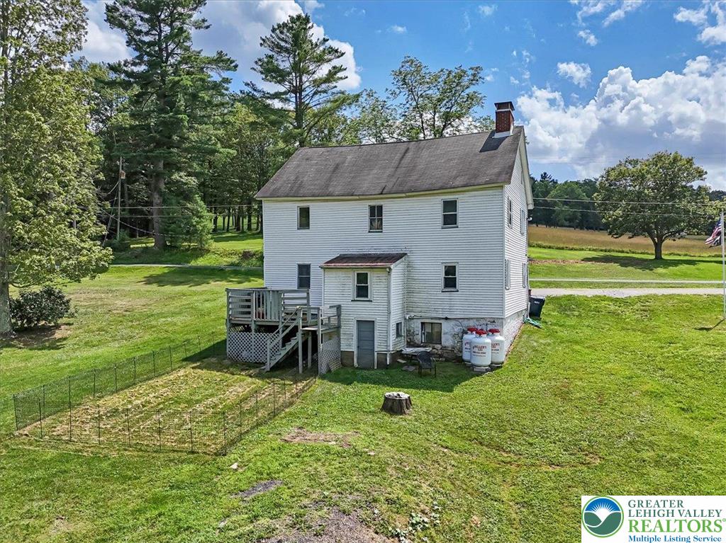 173 Anchorage Road Saylorsburg, PA 18353 - Photo 47 of 75 a view of a house with a big yard potted plants and large tree