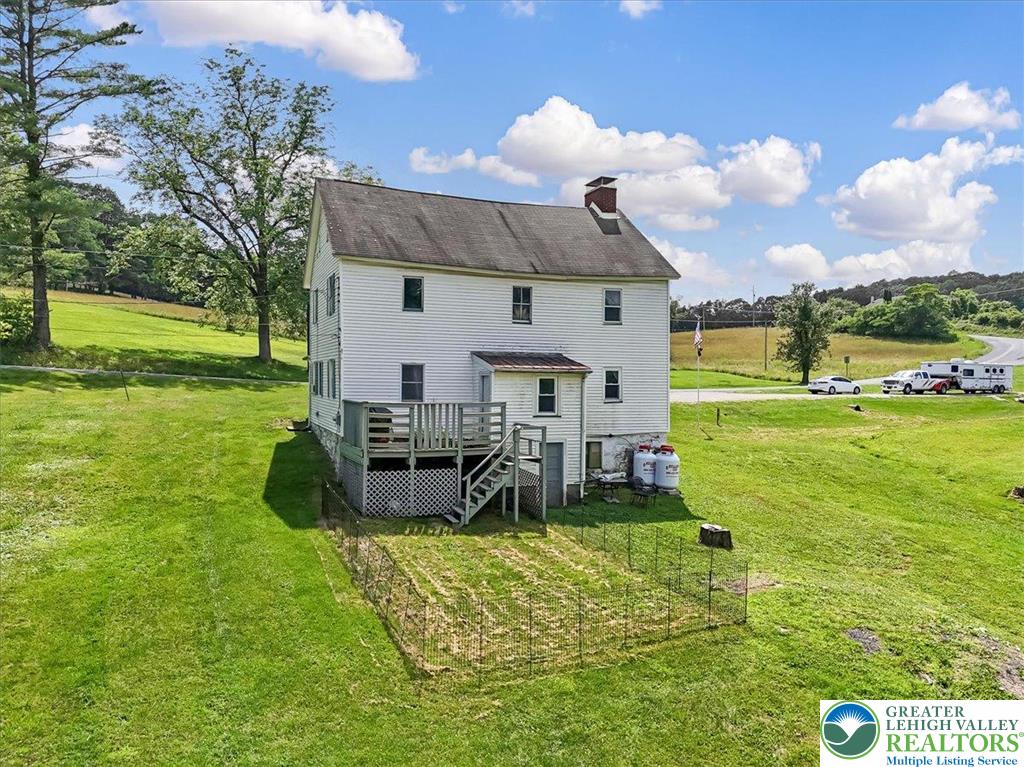 173 Anchorage Road Saylorsburg, PA 18353 - Photo 48 of 75 a view of a house with a backyard porch and sitting area