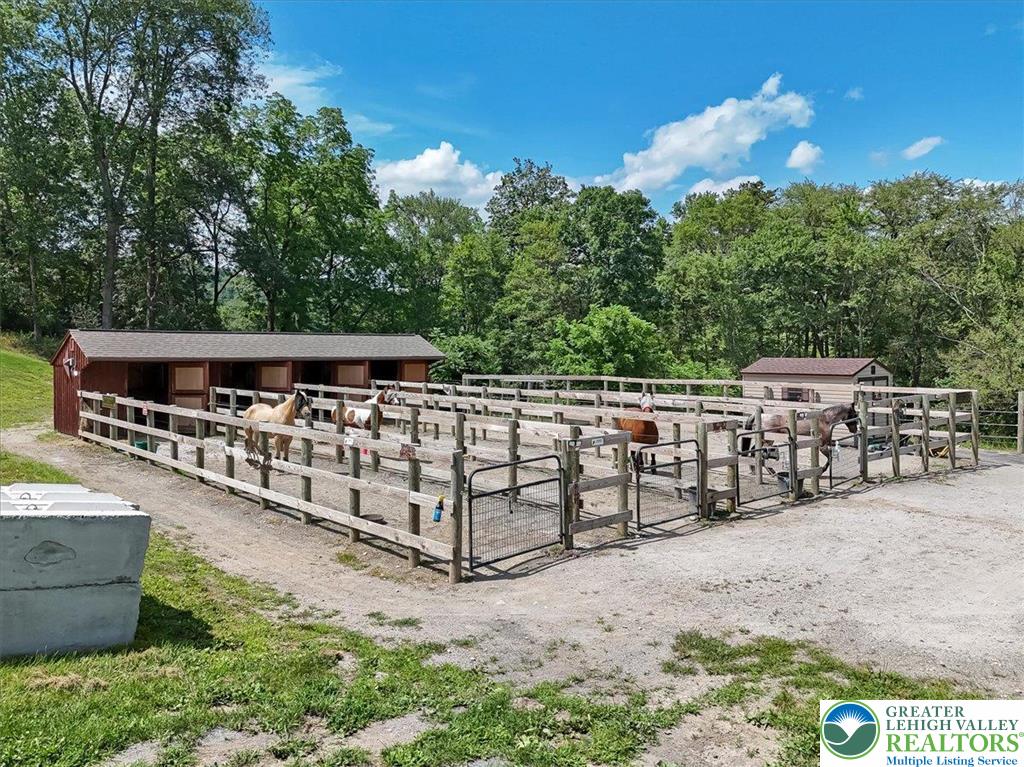 173 Anchorage Road Saylorsburg, PA 18353 - Photo 56 of 75 a view of a dinning table and chairs in the patio