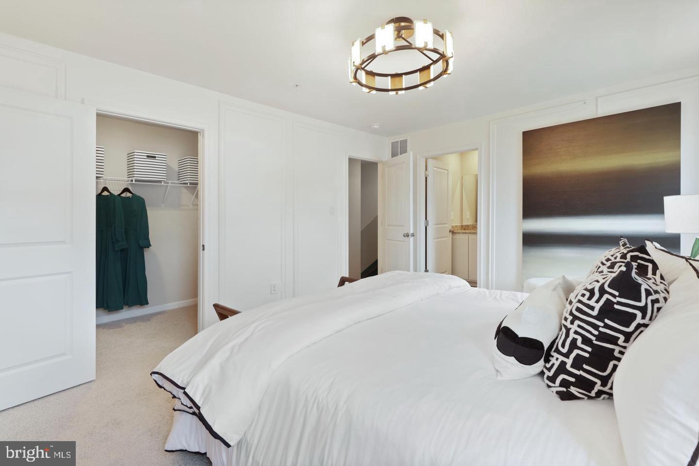 1995 Fauna Drive Frederick, MD 21702 - Photo 12 of 20 a bedroom with a bed and a chandelier