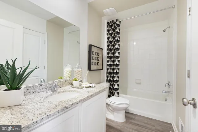 a view of a hallway with white walls and white walls