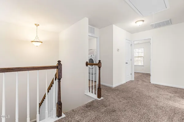a view of a hallway with closet area