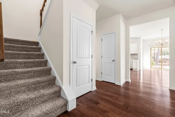a view of an entryway with wooden floor