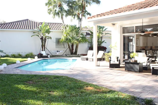 a view of a backyard with sitting area
