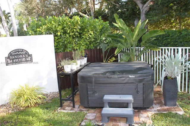 a view of a backyard with sitting area