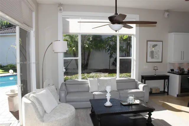 a living room with furniture and a large window