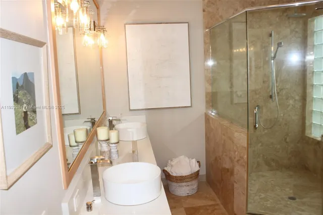 a bathroom with a toilet a sink and shower