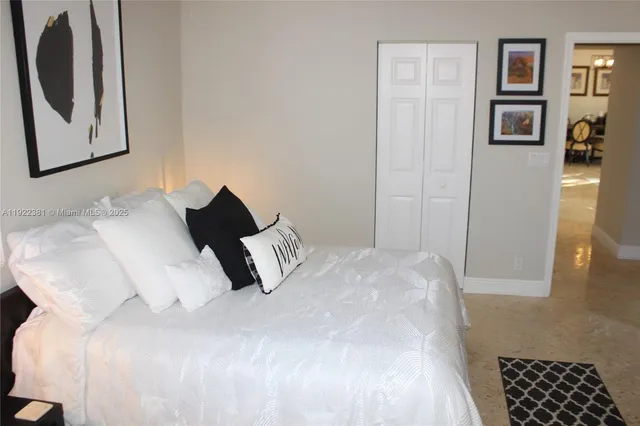 a bedroom with a bed and wall painting