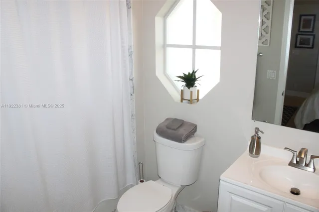 a bathroom with a toilet and a sink