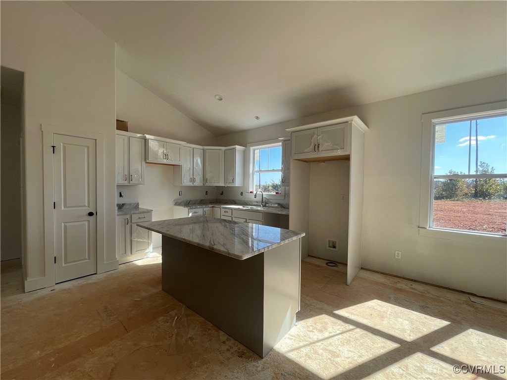 4724 Country Club Road La Crosse, VA 23950 - Photo 4 of 17 a kitchen with kitchen island granite countertop a sink stove and refrigerator