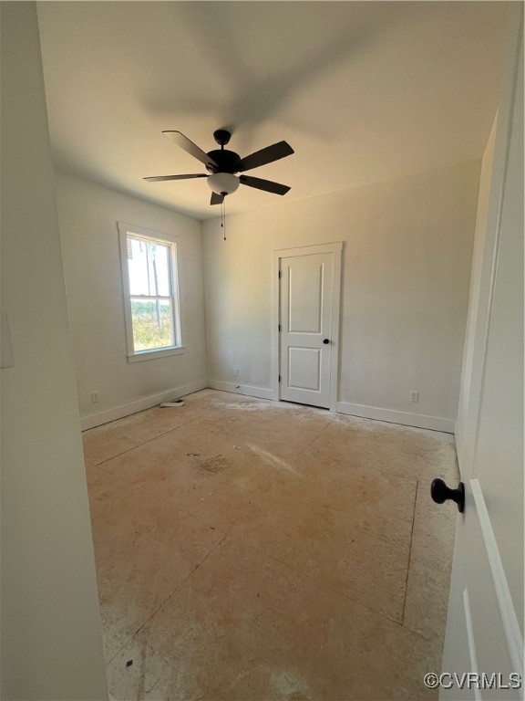 4724 Country Club Road La Crosse, VA 23950 - Photo 7 of 17 an empty room with windows and fan