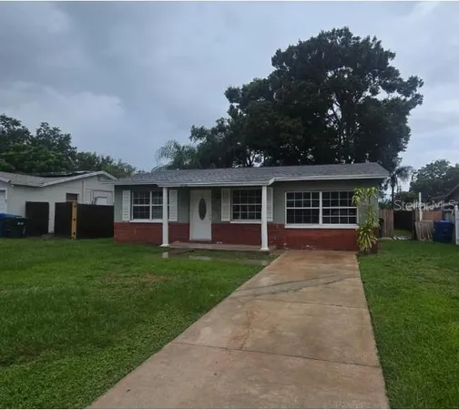 front view of a house with a garden