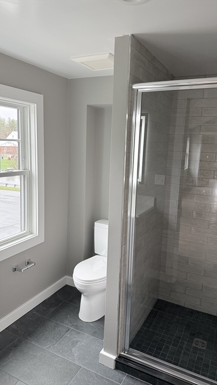 944 East Street, Unit 3 Walpole, MA 02081 - Photo 20 of 23 a bathroom with a toilet and a shower