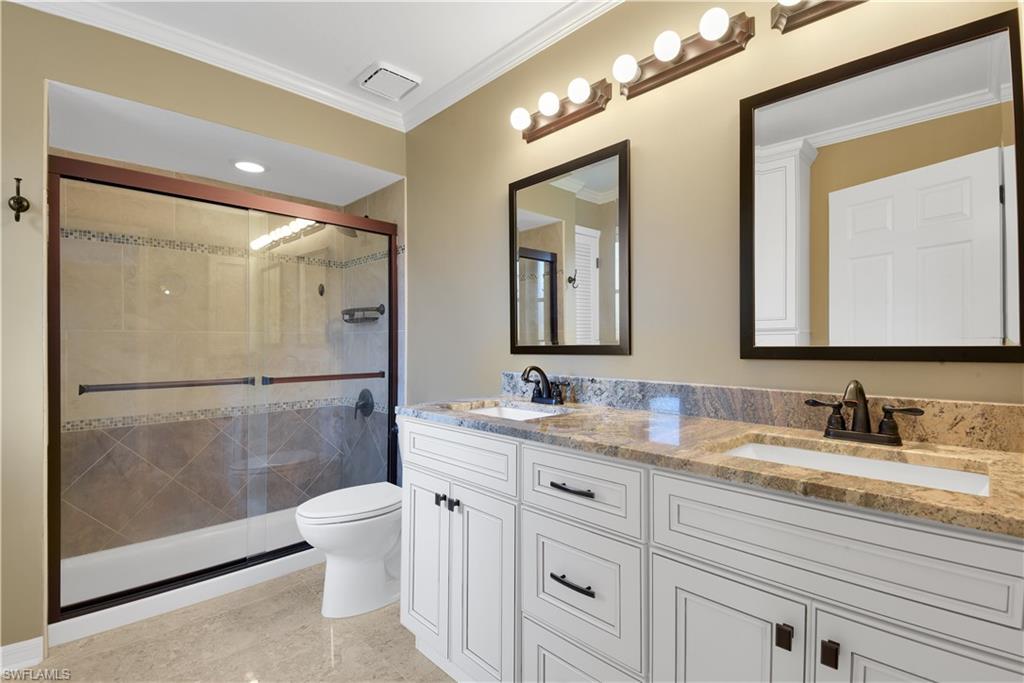 17557 Butler Road Fort Myers, FL 33967 - Photo 23 of 35 a bathroom with a double vanity sink mirror and toilet