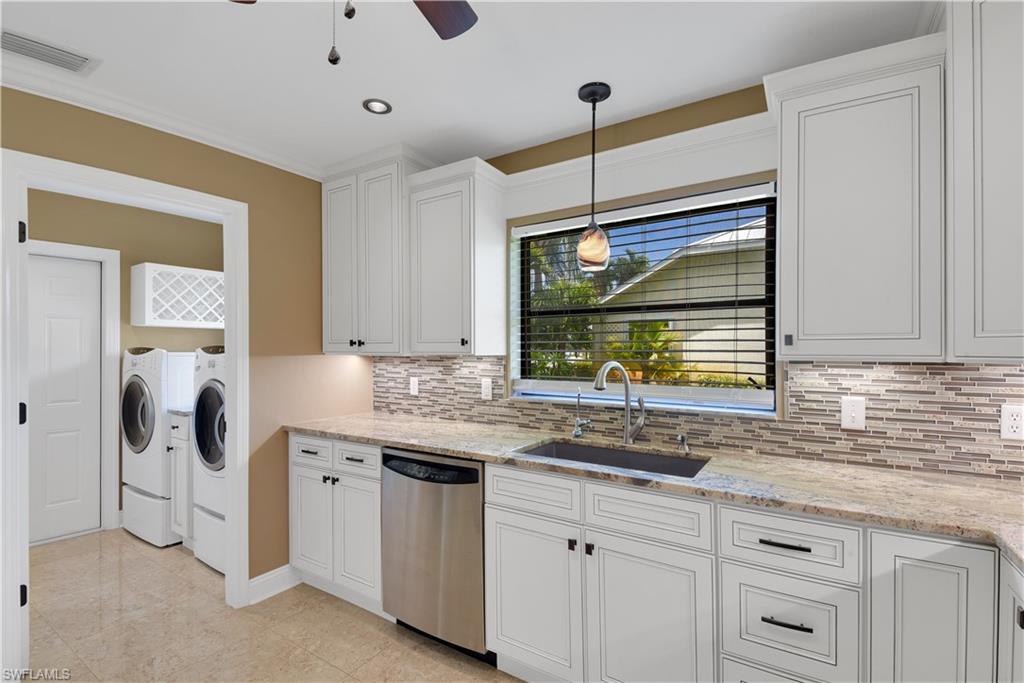 17557 Butler Road Fort Myers, FL 33967 - Photo 8 of 35 a kitchen with a sink and a wooden floor