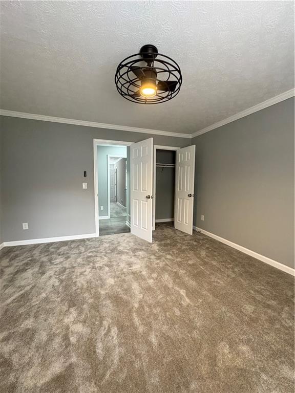 701 Pine Tree Trail, Unit 10E Atlanta, GA 30349 - Photo 28 of 33 a view of an empty room and chandelier fan