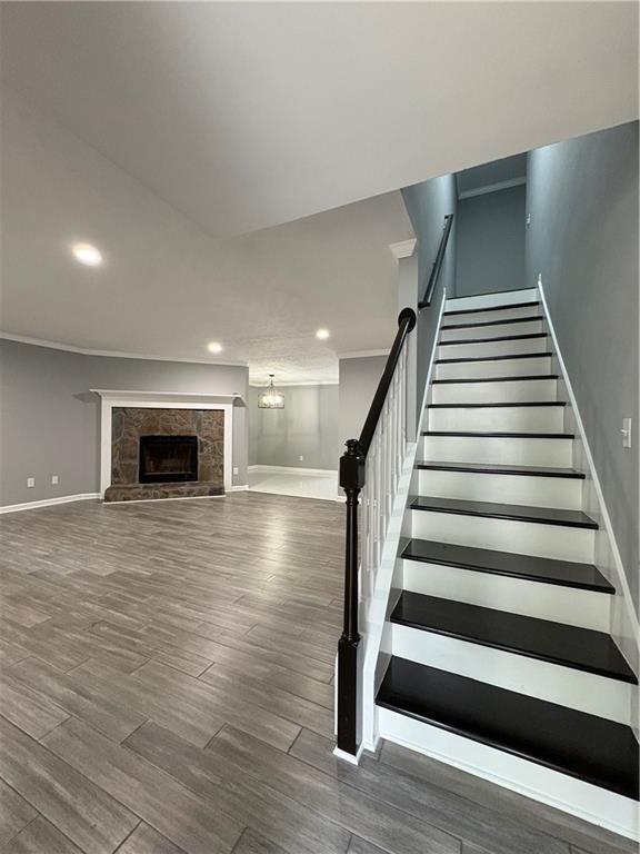 701 Pine Tree Trail, Unit 10E Atlanta, GA 30349 - Photo 3 of 33 a view of an empty room with wooden floor fireplace and windows