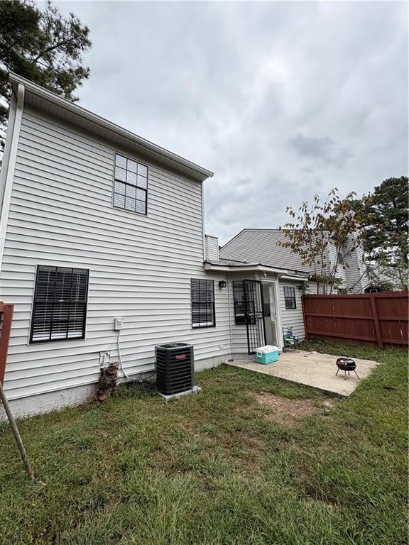 701 Pine Tree Trail, Unit 10E Atlanta, GA 30349 - Photo 31 of 33 a front view of a house with a yard