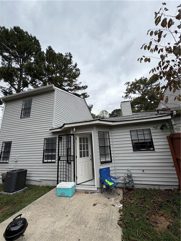 701 Pine Tree Trail, Unit 10E Atlanta, GA 30349 - Photo 32 of 33 a white house that has tree in front of it